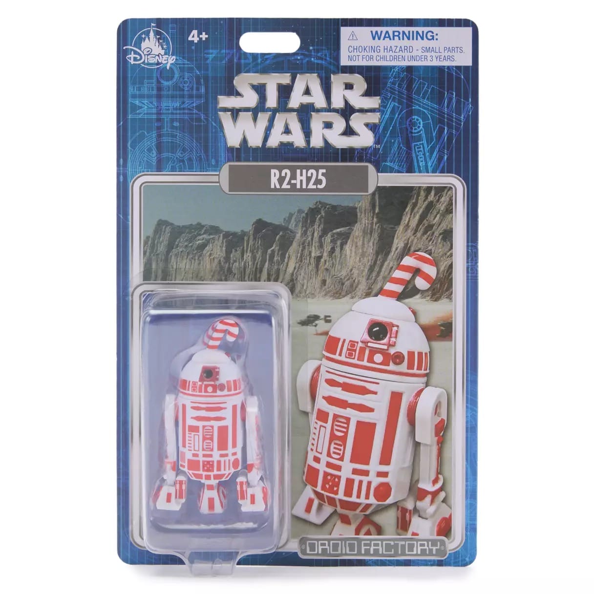 Star Wars R2-H25 droid action figure in packaging with a candy cane design and scenic background.