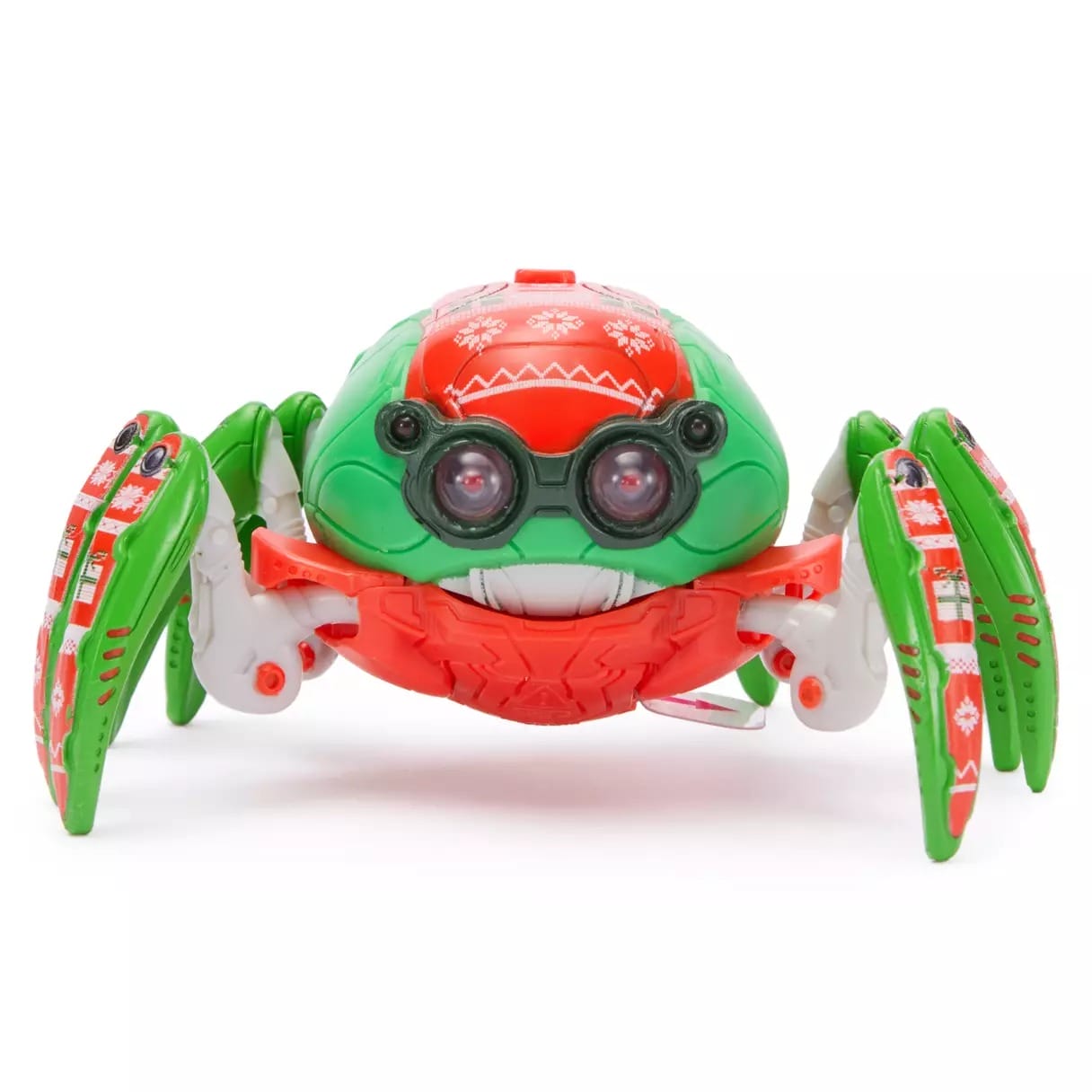 A toy crab robot with green and red colors, holiday sweater patterns, and two large round eyes.