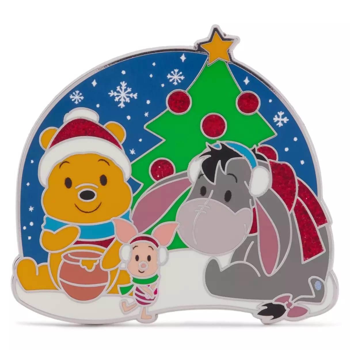 Winnie the Pooh, Piglet, and Eeyore in winter clothes by a Christmas tree with snowflakes in the background.