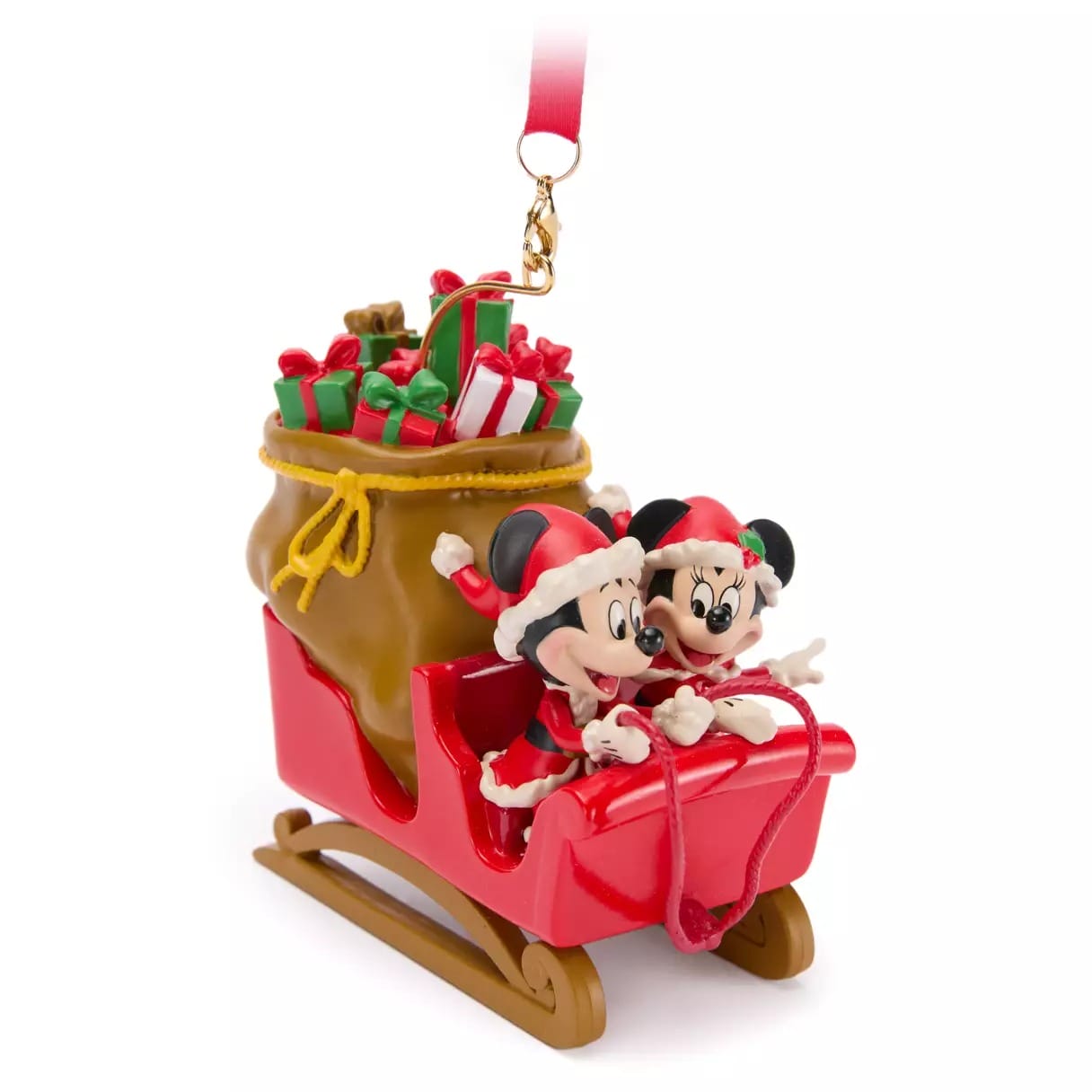 Ornament of Mickey and Minnie Mouse in a red sleigh with a sack of gifts, both wearing Santa hats and smiling.
