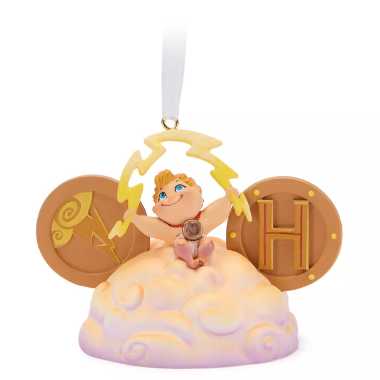 Ornament of baby Hercules holding lightning on a cloud, with gold shields and a white ribbon for hanging.