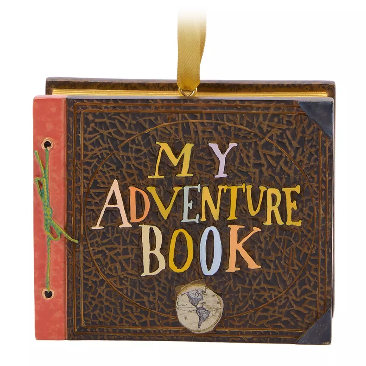 A scrapbook with "My Adventure Book" written on the cover and a small globe illustration at the bottom.
