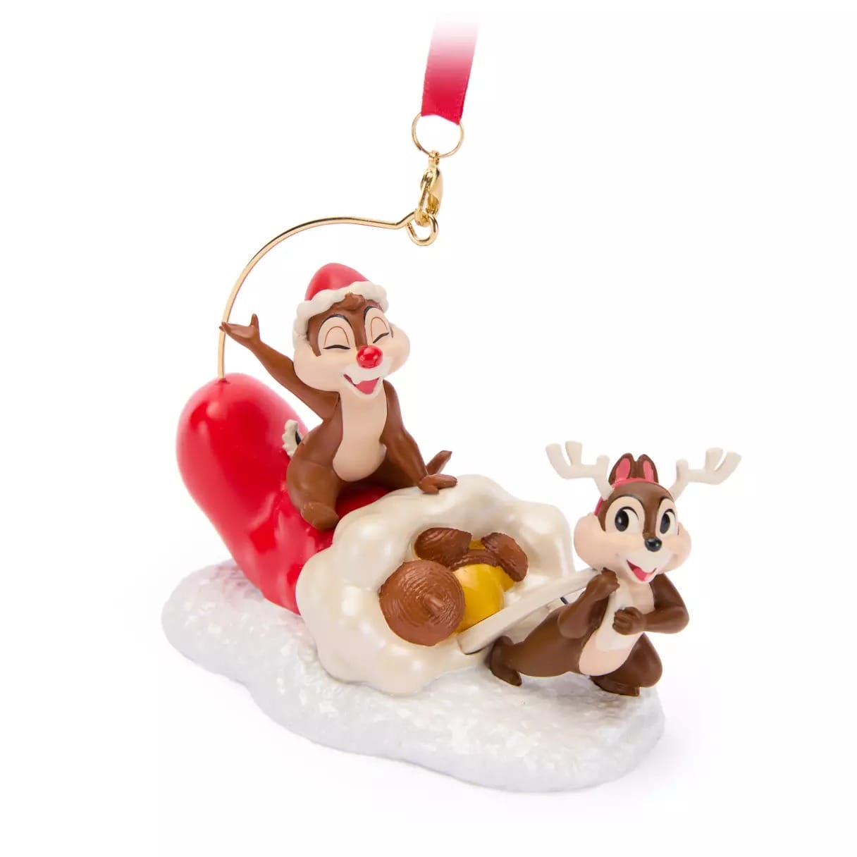 Two cartoon chipmunks in festive outfits sit with nuts on snow, one wearing antlers, the other a Santa hat.