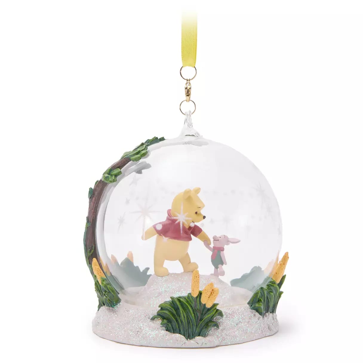 A Disney Store Winnie the Pooh and Piglet ornament in a globe with yellow ribbon—perfect 2025 Christmas merchandise.