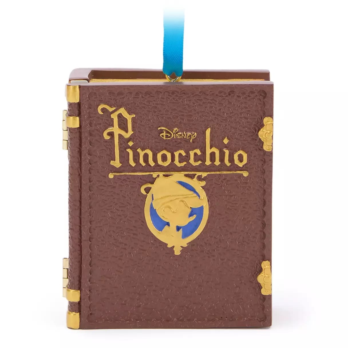 A brown Disney Pinocchio book ornament from the Disney Store, perfect for 2025 Christmas merchandise collectors.