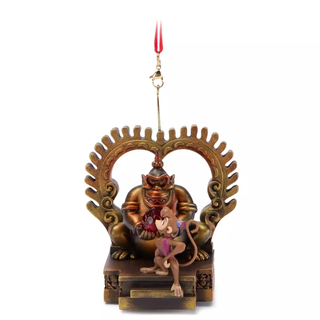 A monkey figurine with a red gem sits before a golden idol on this Disney Store 2025 Christmas merchandise ornament.
