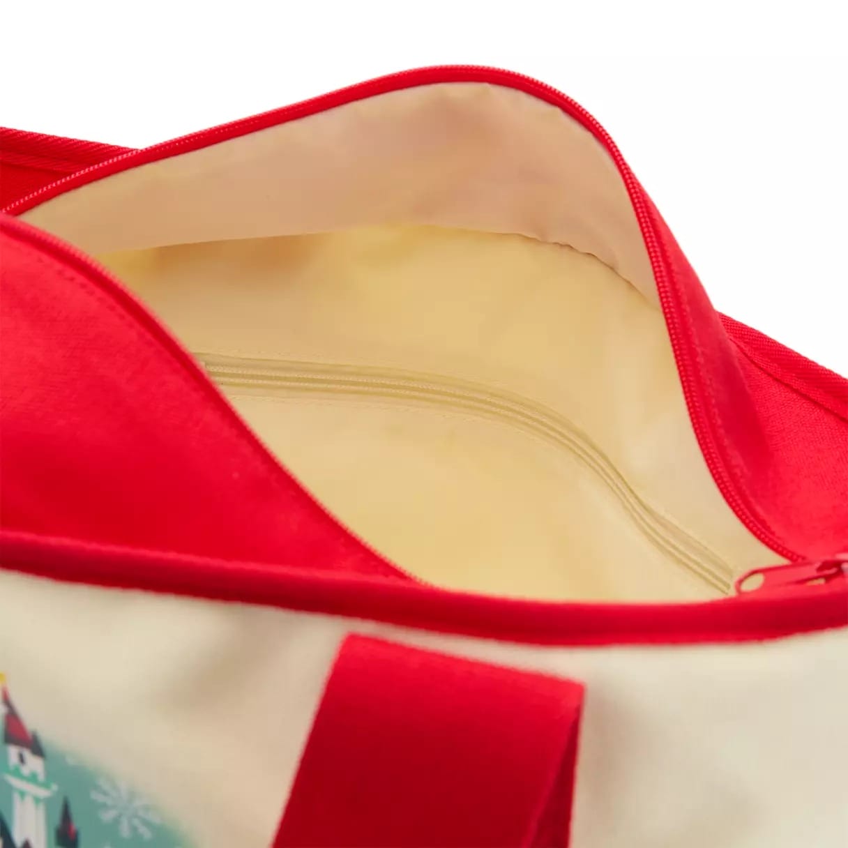Open red and cream tote bag with a cream-colored interior and zip pocket, reminiscent of Main Street shopping bags at Disney Parks.