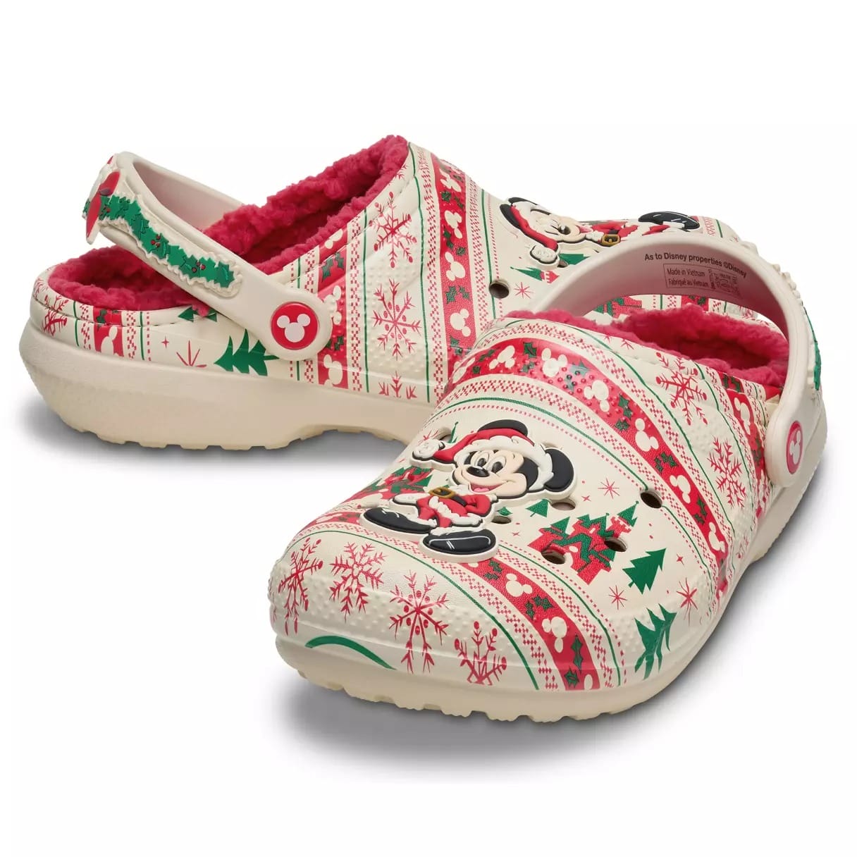 White Crocs with Fair Isle holiday patterns, Minnie Mouse, snowflakes, and cozy red fleece, perfect for a Disney parks winter stroll.