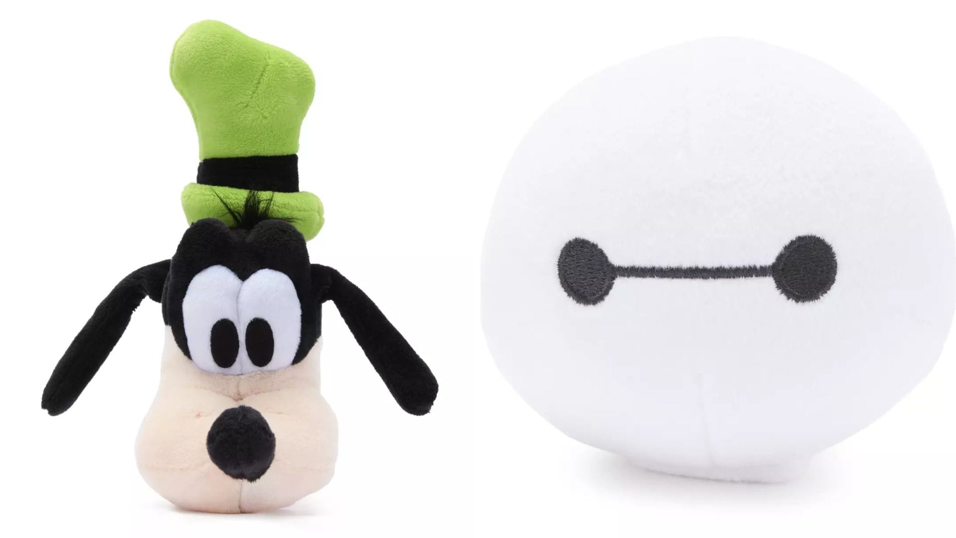 Two plush headband heads of Goofy and Baymax.
