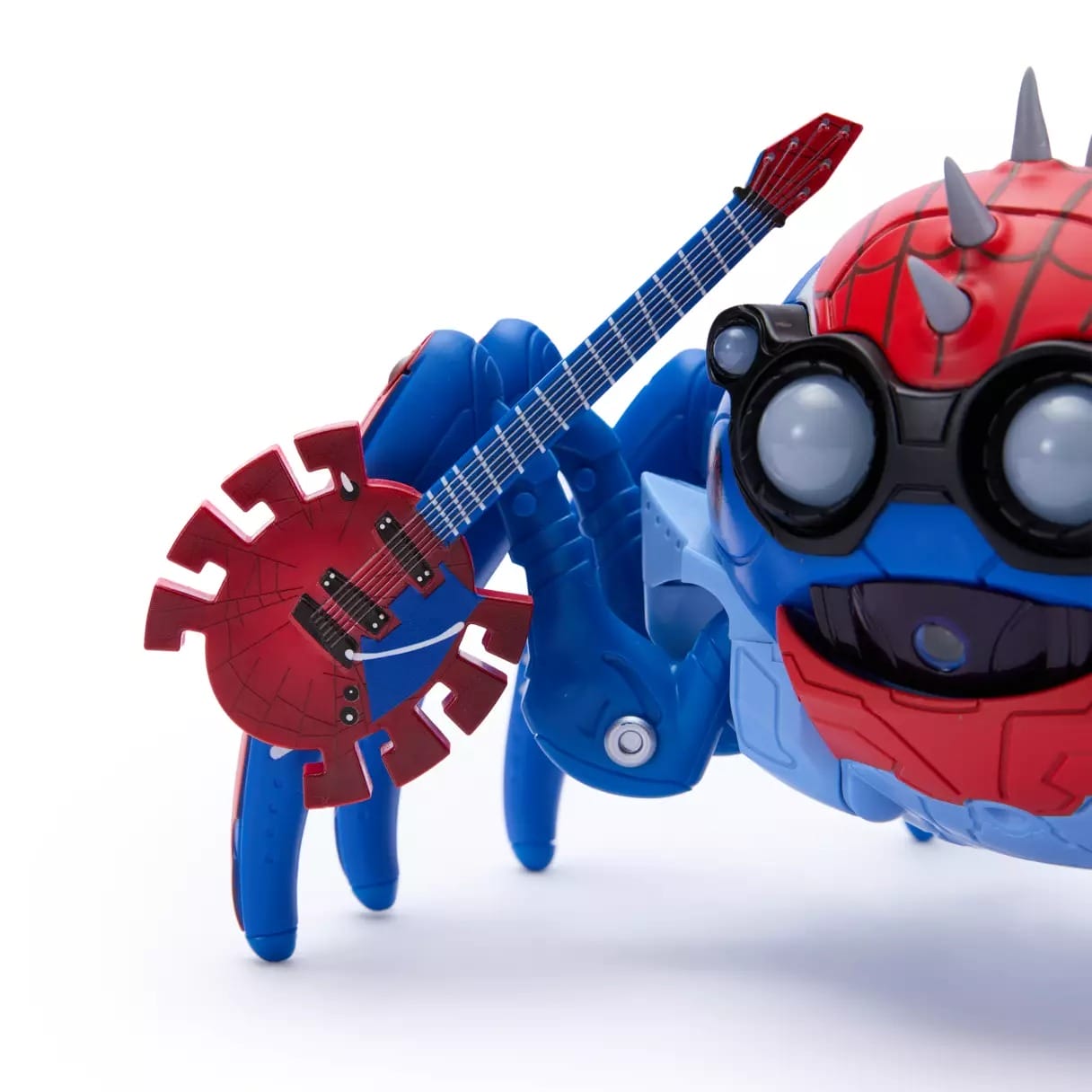 A Spider-Punk Spider-Bot toy in blue and red holds a web-patterned red guitar, as seen in Disney Parks merchandise displays.