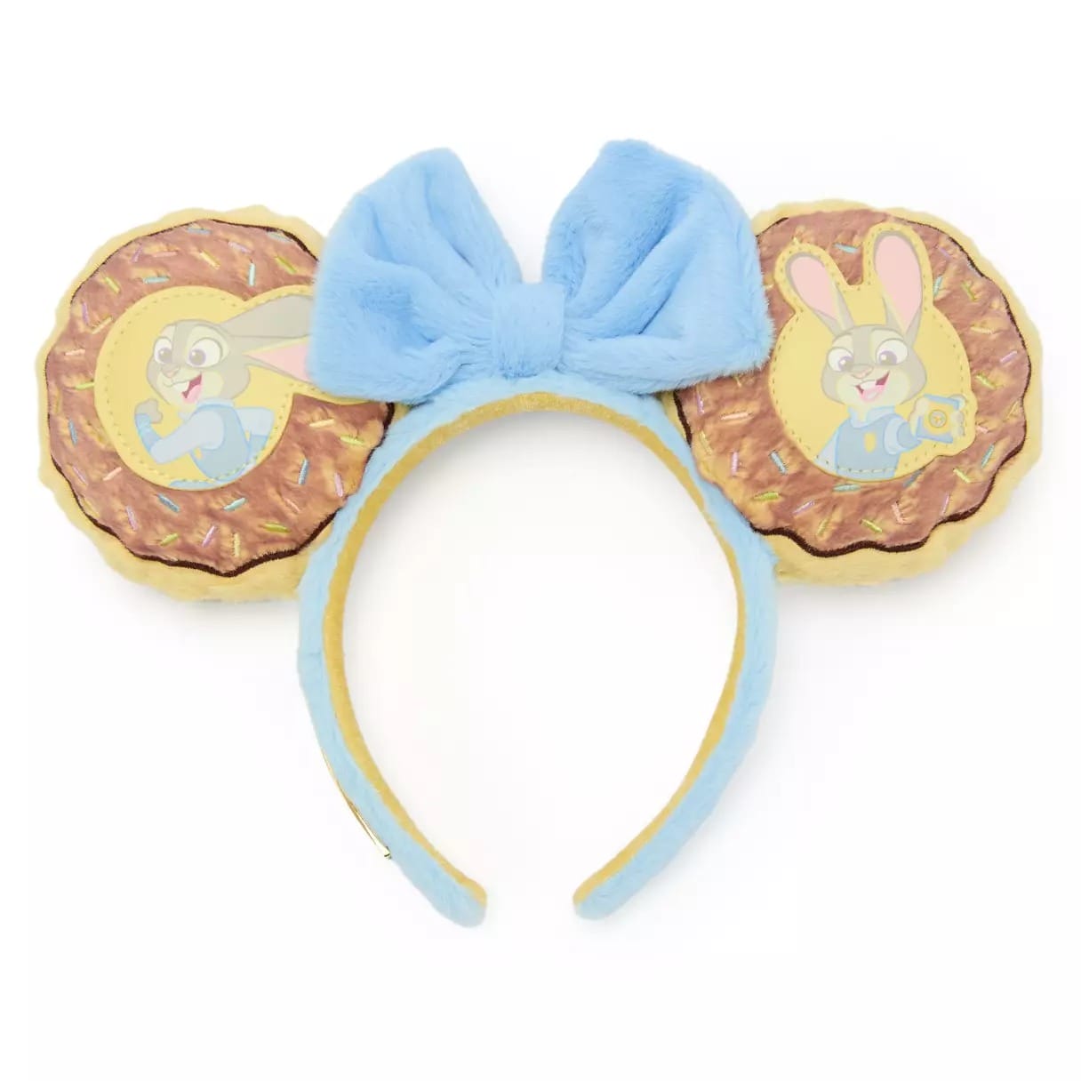Light blue headband with plush bow, two cookie-shaped ears, each ear featuring cartoon bunnies—Disney parks souvenir style.