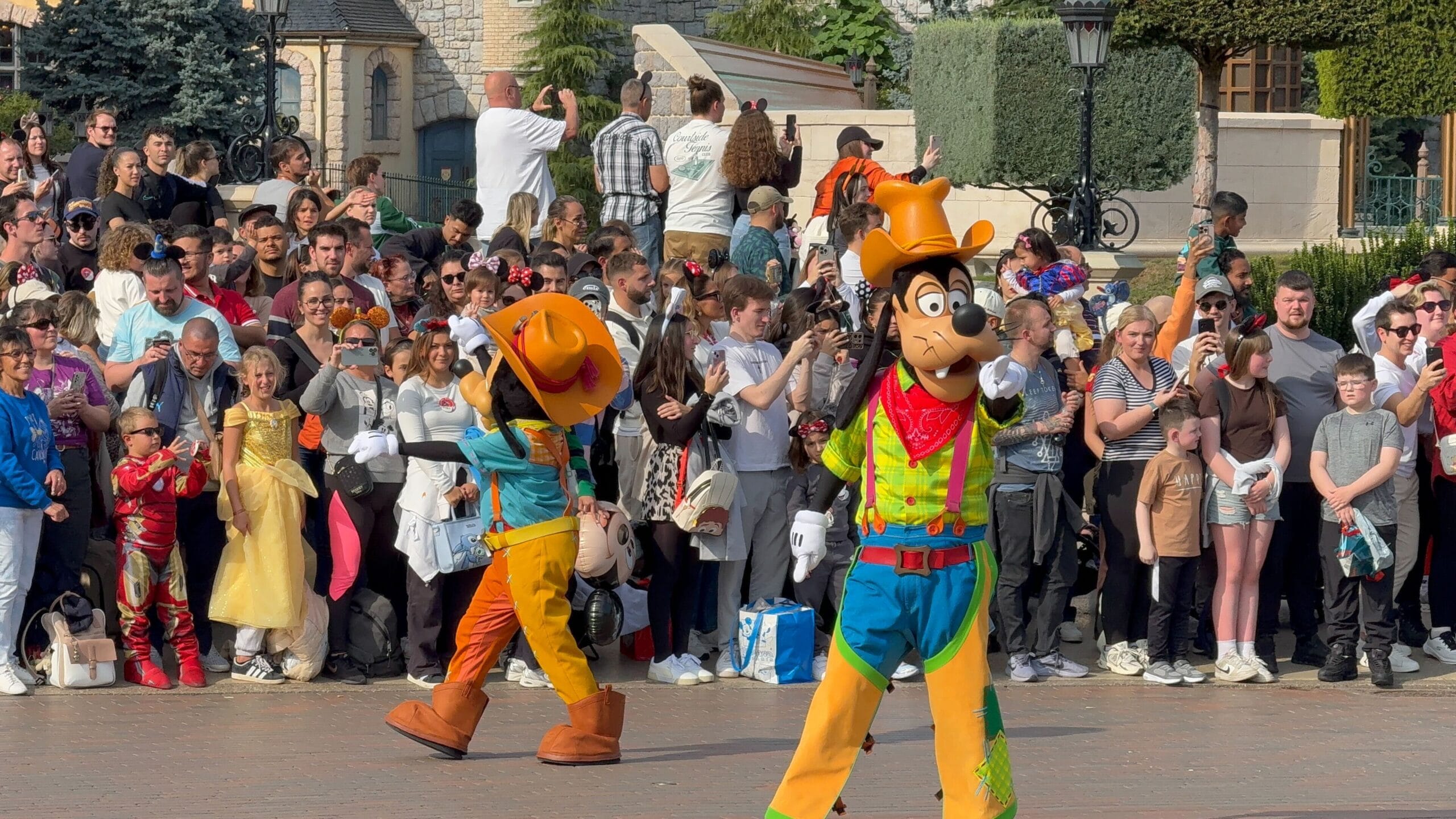 Goofy and another Disney character entertain crowds during Mickey’s Halloween Celebration Parade at Disneyland Paris 2025.