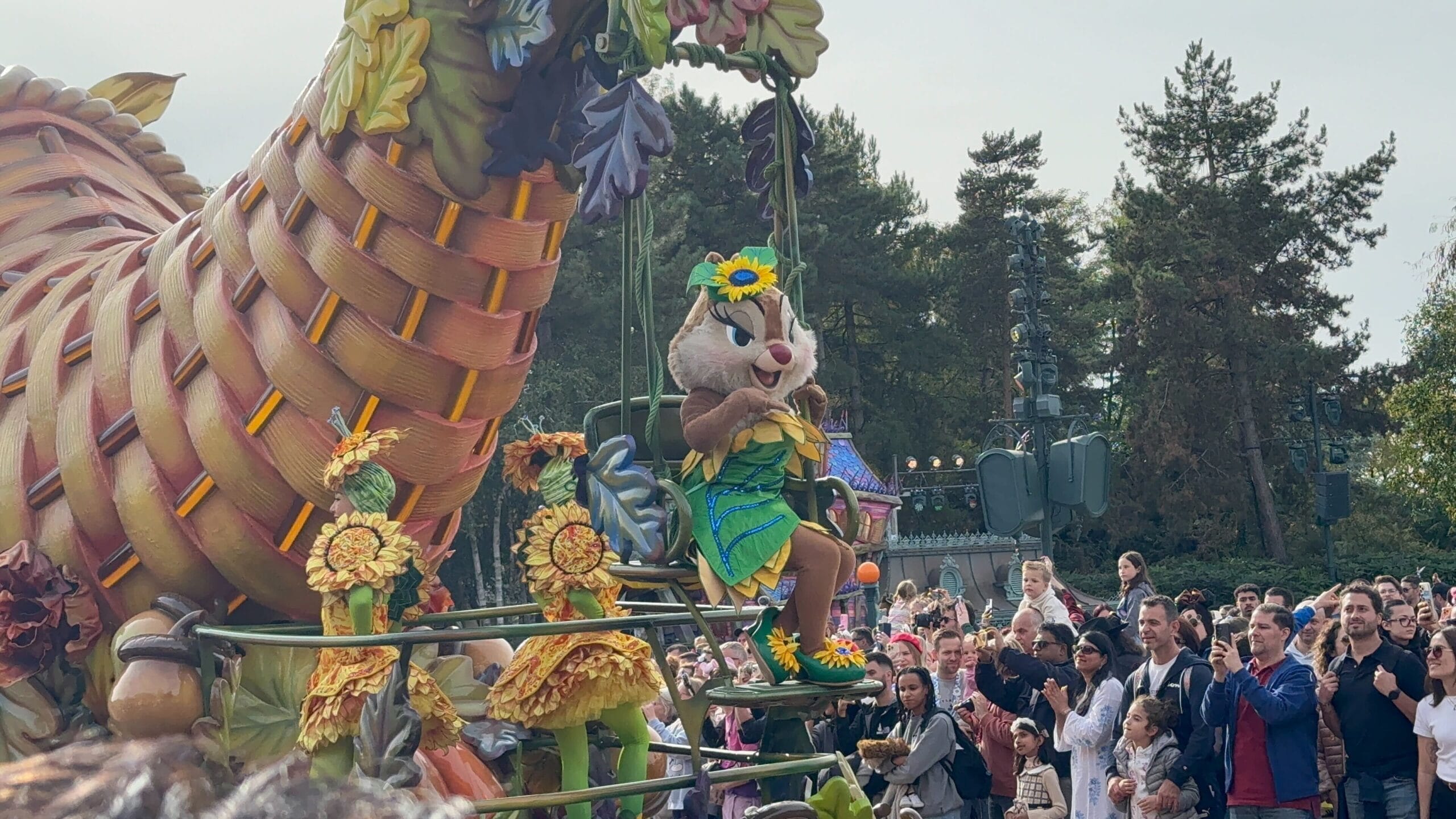 A chipmunk in a green costume rides a float during Mickey’s Halloween Celebration Parade at Disneyland Paris 2025.