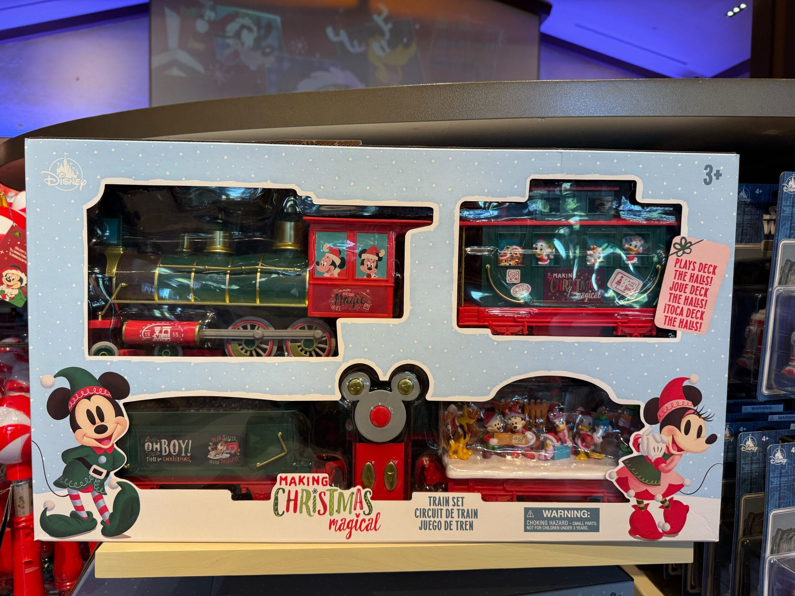 Festive Disneyland Peppermint Collection train set with Minnie and Mickey art; no castle, so can’t compare Disney park castles.