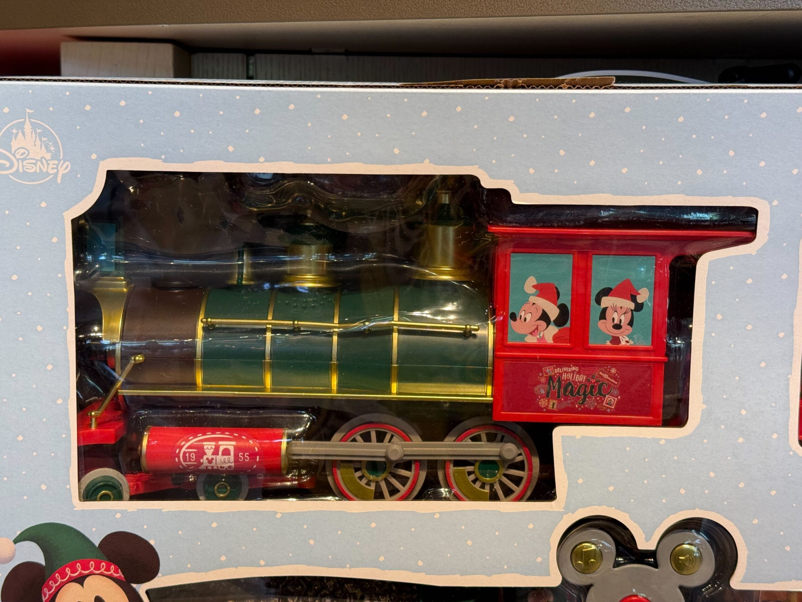 Peppermint Collection toy train boxed set with Disney Parks branding, Mickey and Minnie in the cab, festive Disney packaging.
