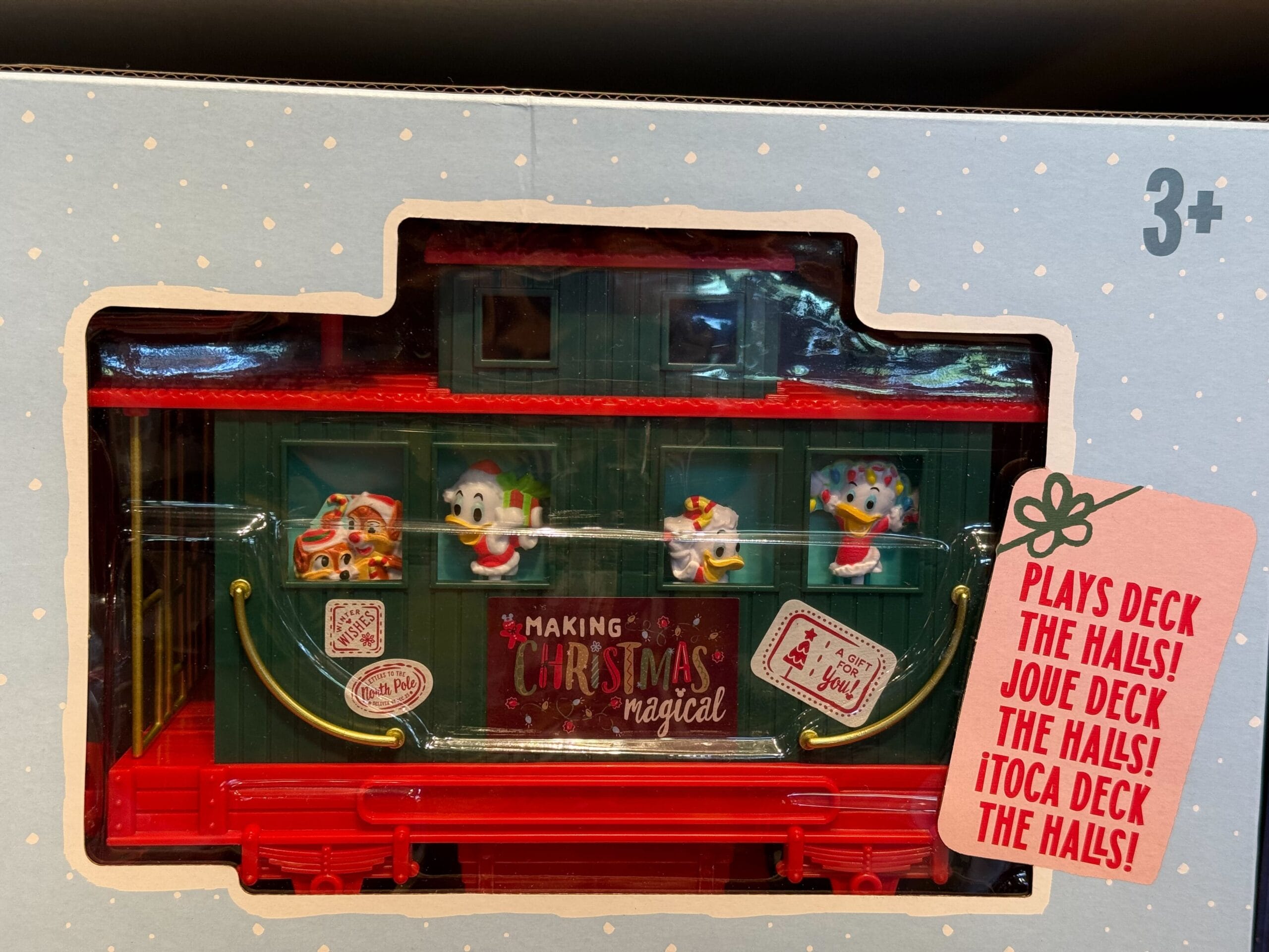 Peppermint Collection toy train car with Disney-style cartoon characters, "Making Christmas Magical" sign, for ages 3+.