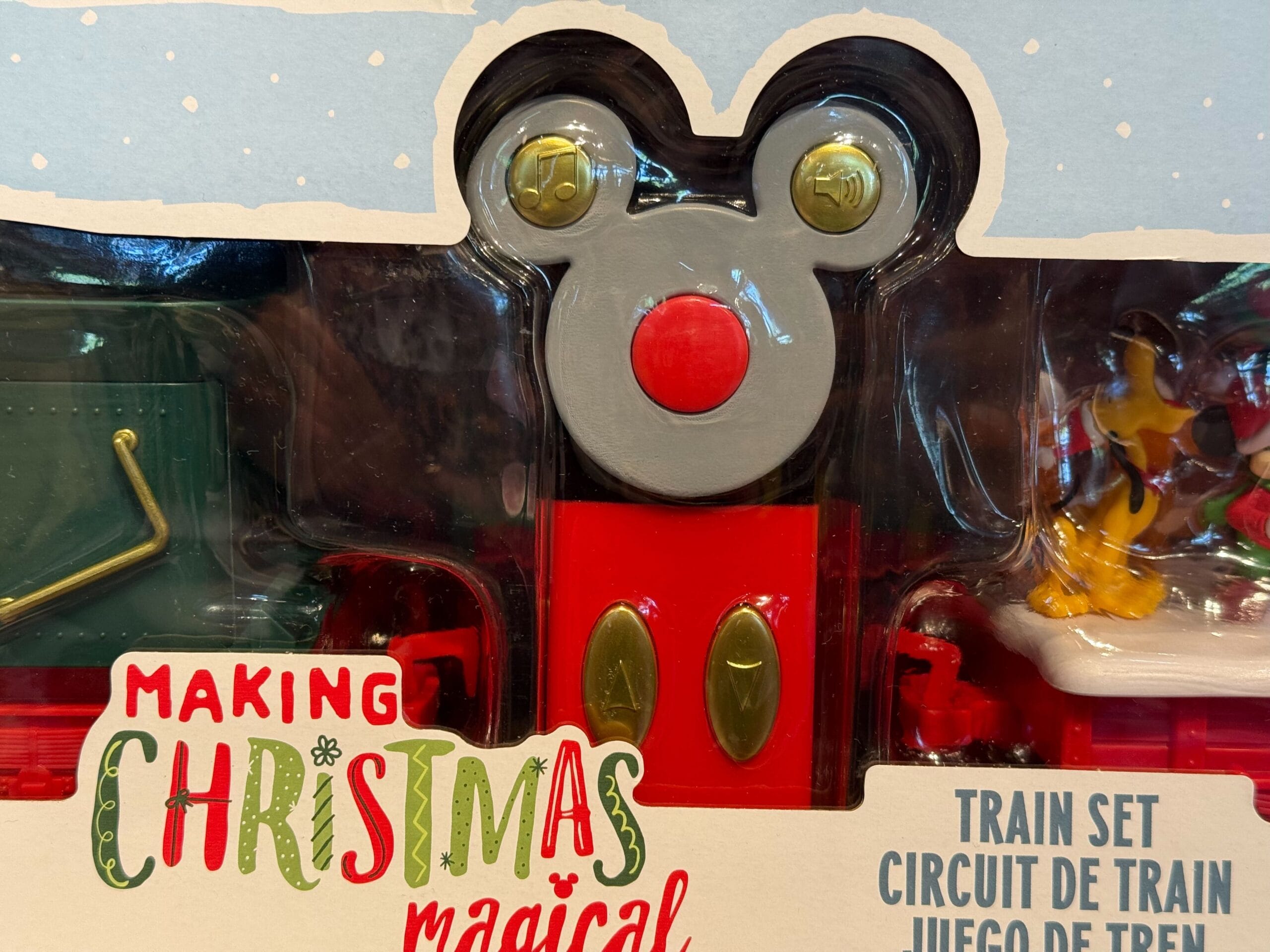 Disneyland Christmas toy train set package featuring Mickey Mouse details, exclusive park merchandise reminiscent of Main Street.