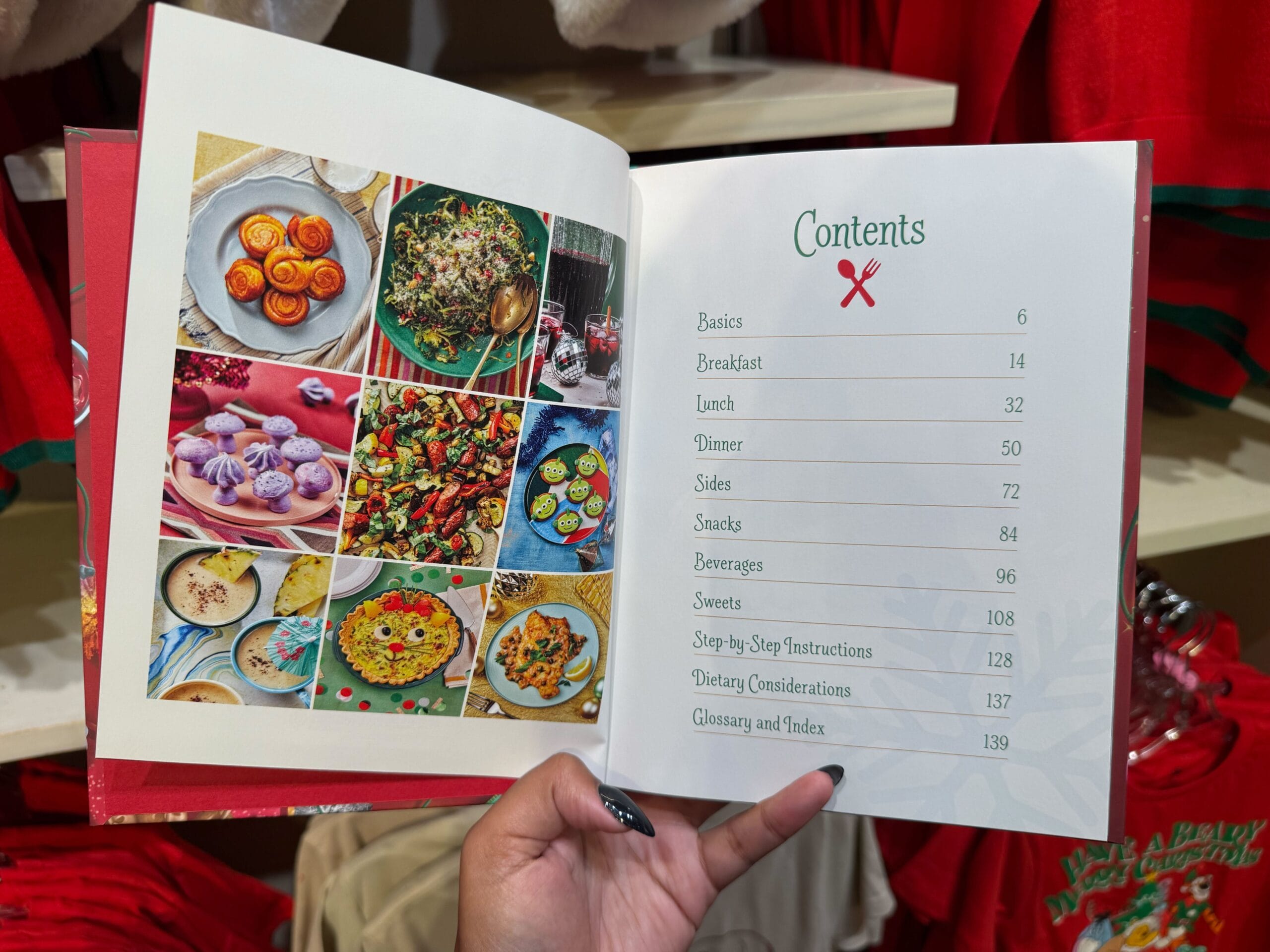 A hand holds open a Peppermint Collection cookbook, its festive collage and contents page echoing the whimsy found in Disney parks.