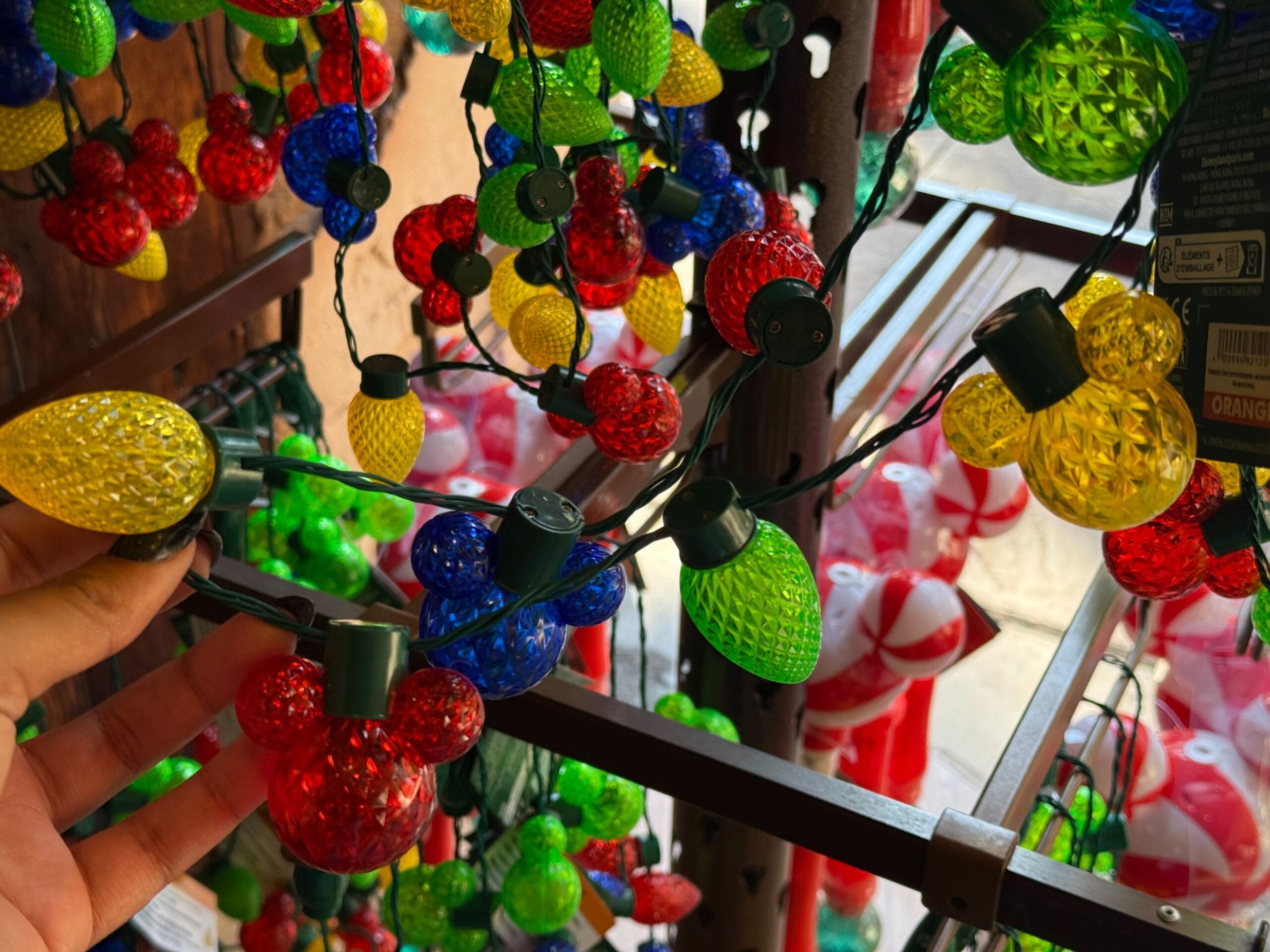 Vibrant Mickey Mouse-shaped string lights as a festive New Arrivals feature at Disneyland Resort’s Christmas display—not a castle.