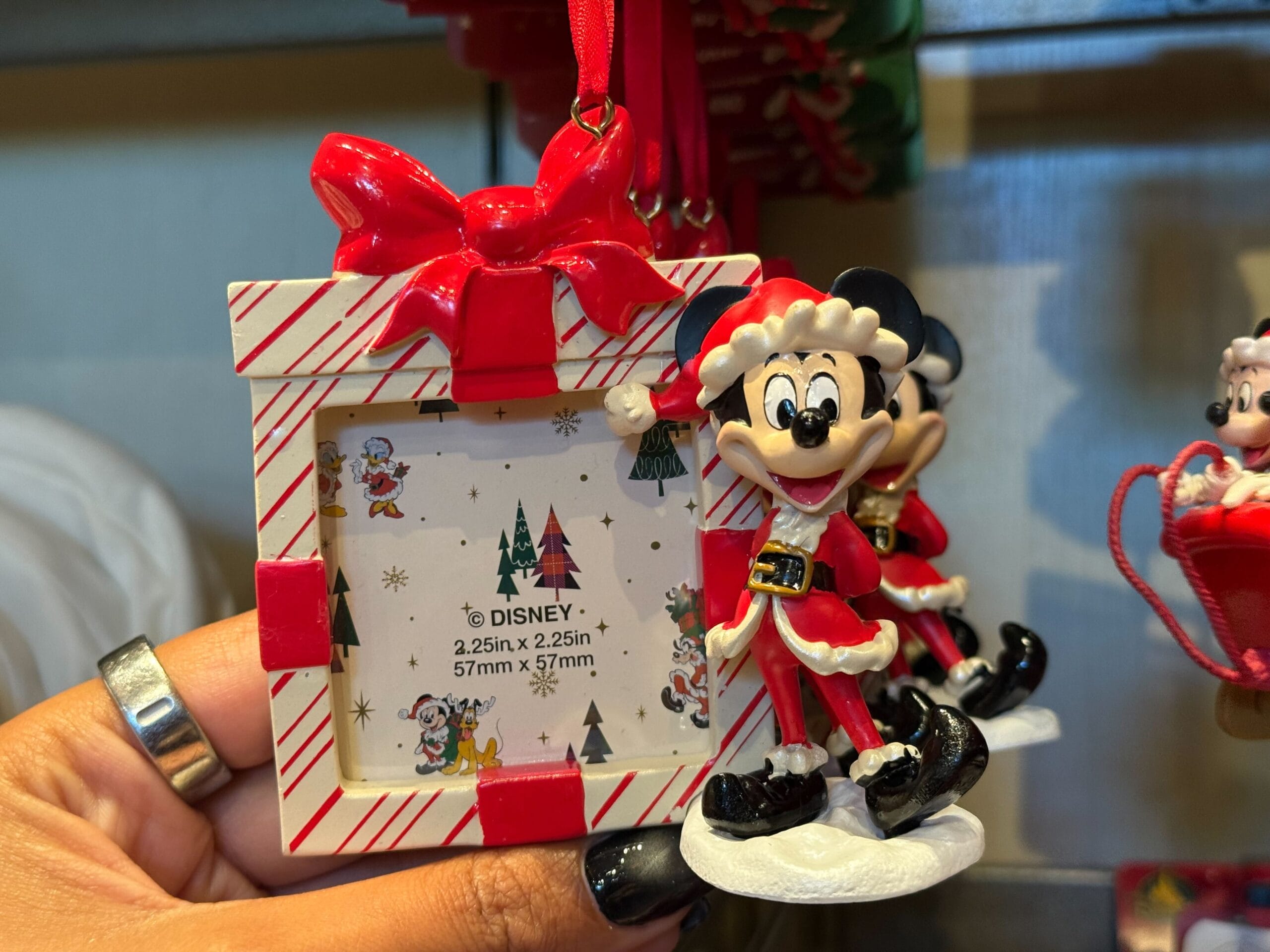 Minnie Mouse Christmas ornament in a festive frame—new from Disneyland Resort, home to Sleeping Beauty Castle, unlike Magic Kingdom’s.