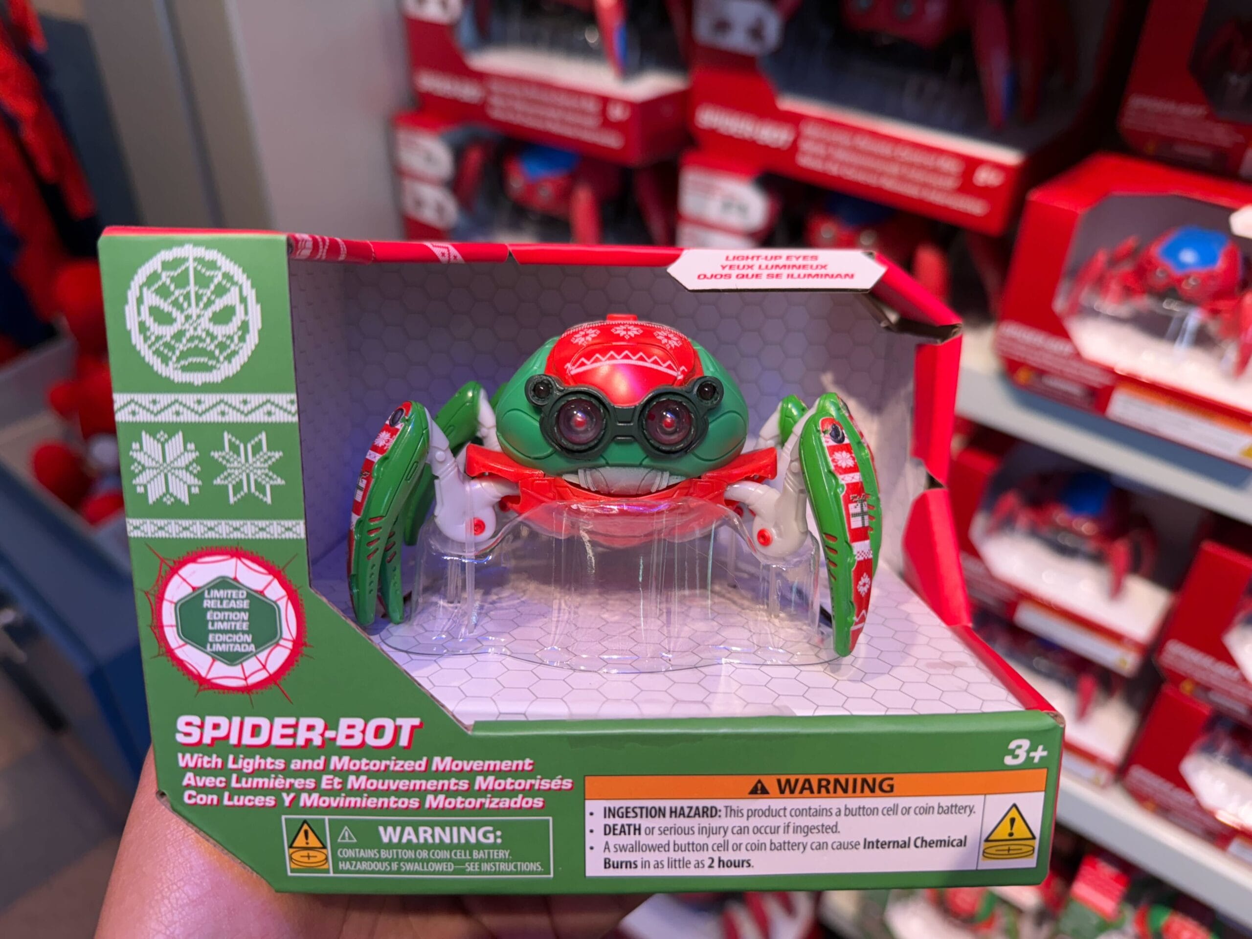A Christmas Spider-Bot toy with lights, motor action, and festive Disneyland Resort box—perfect for kids at Disney Parks worldwide.