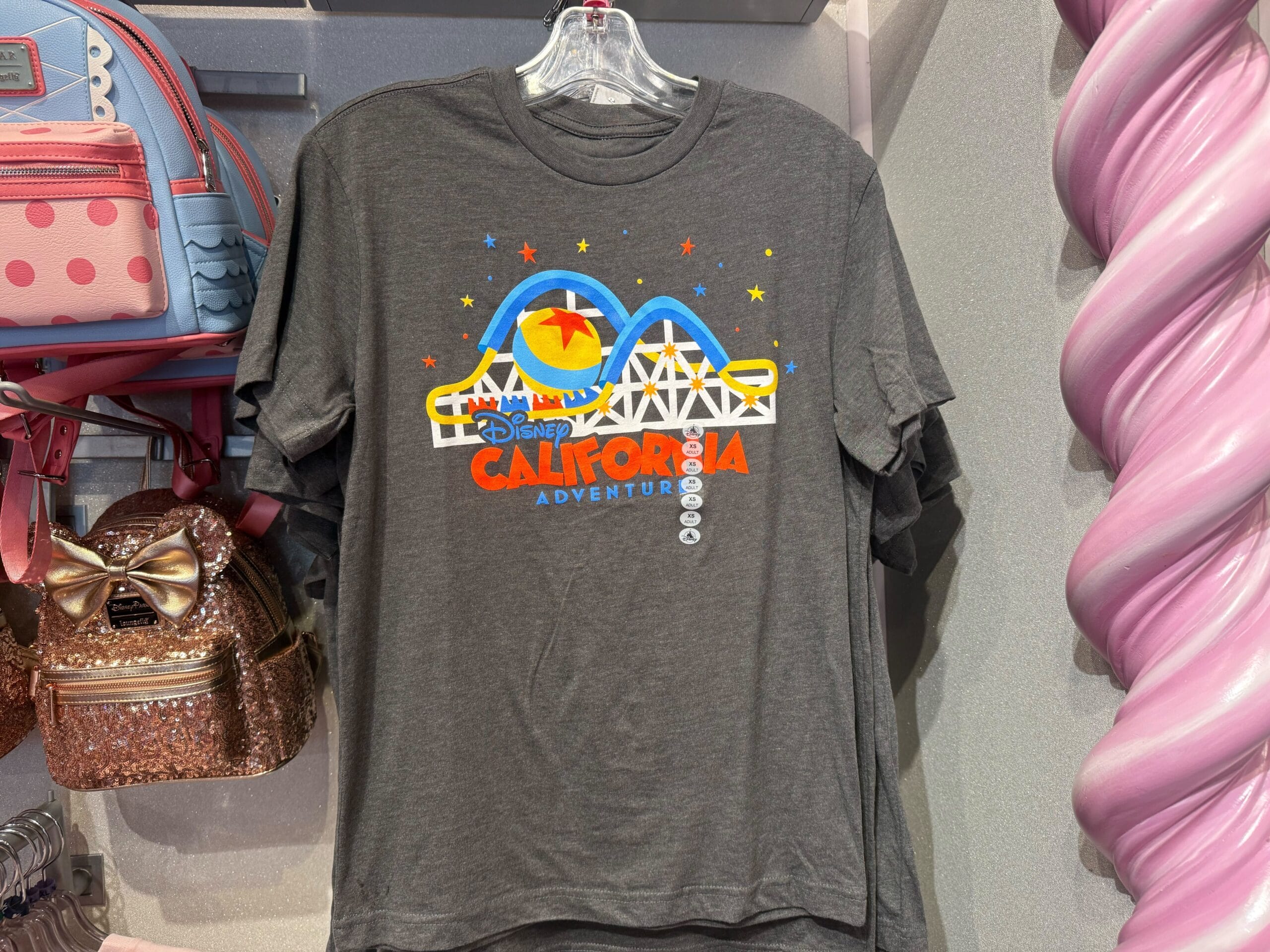 Gray Disney California Adventure T-shirt featuring a vibrant graphic of Pixar Pier’s coaster with ride vehicles.