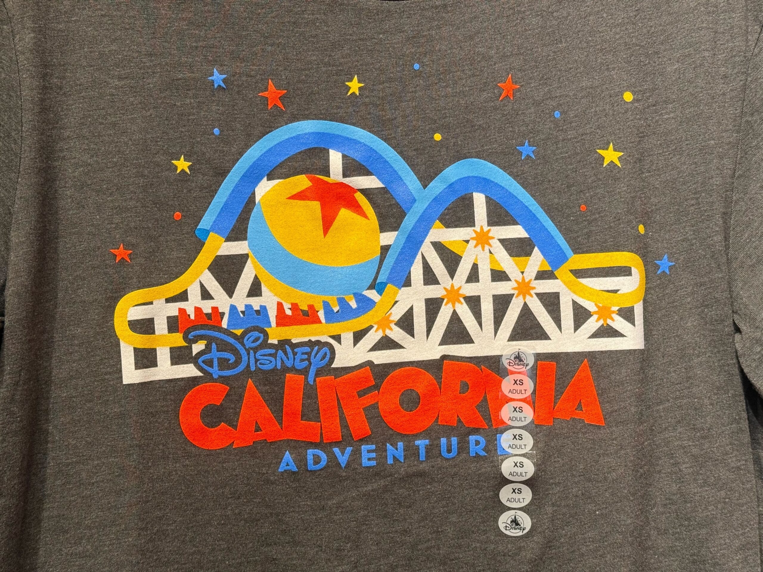 Gray shirt with vibrant Disney California Adventure logo showing a roller coaster and Pixar Luxo ball.