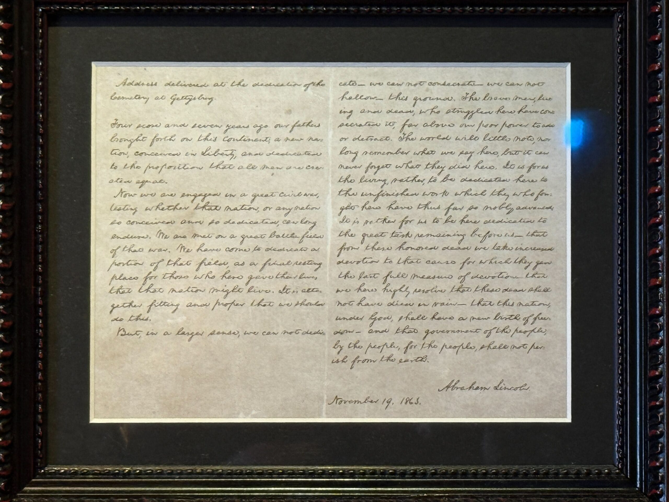 Framed handwritten letter, two columns, signed "Abraham Lincoln," dated Nov 19, 1863—not a Disney park castle comparison.