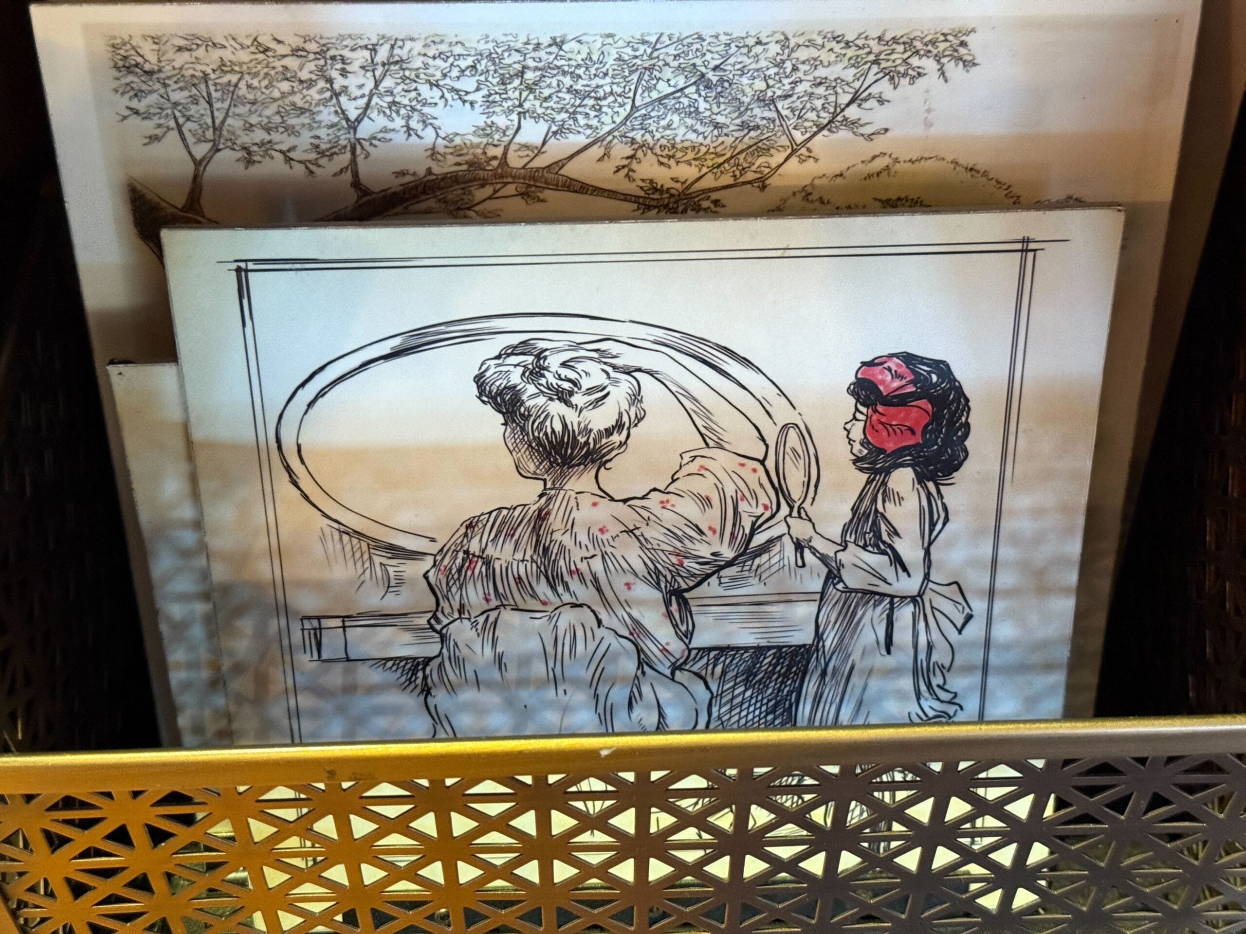 A pen drawing of a woman at a vanity and a girl in a red bonnet, with another scene behind—no Disney castle in this artwork.
