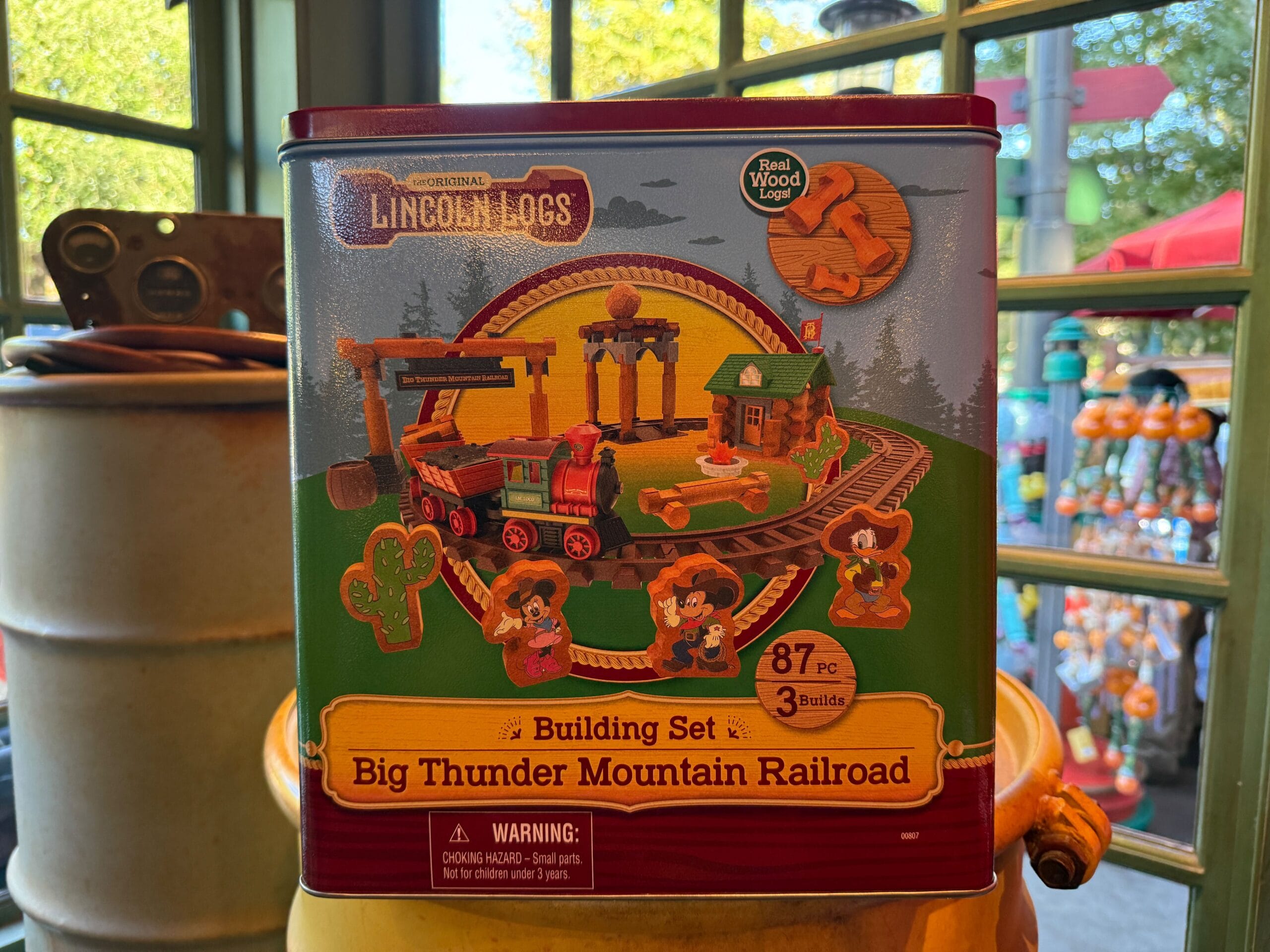 Lincoln Log Sets Big Thunder Mountain Railroad box displayed in-store, inspired by Frontierland train and track illustration.