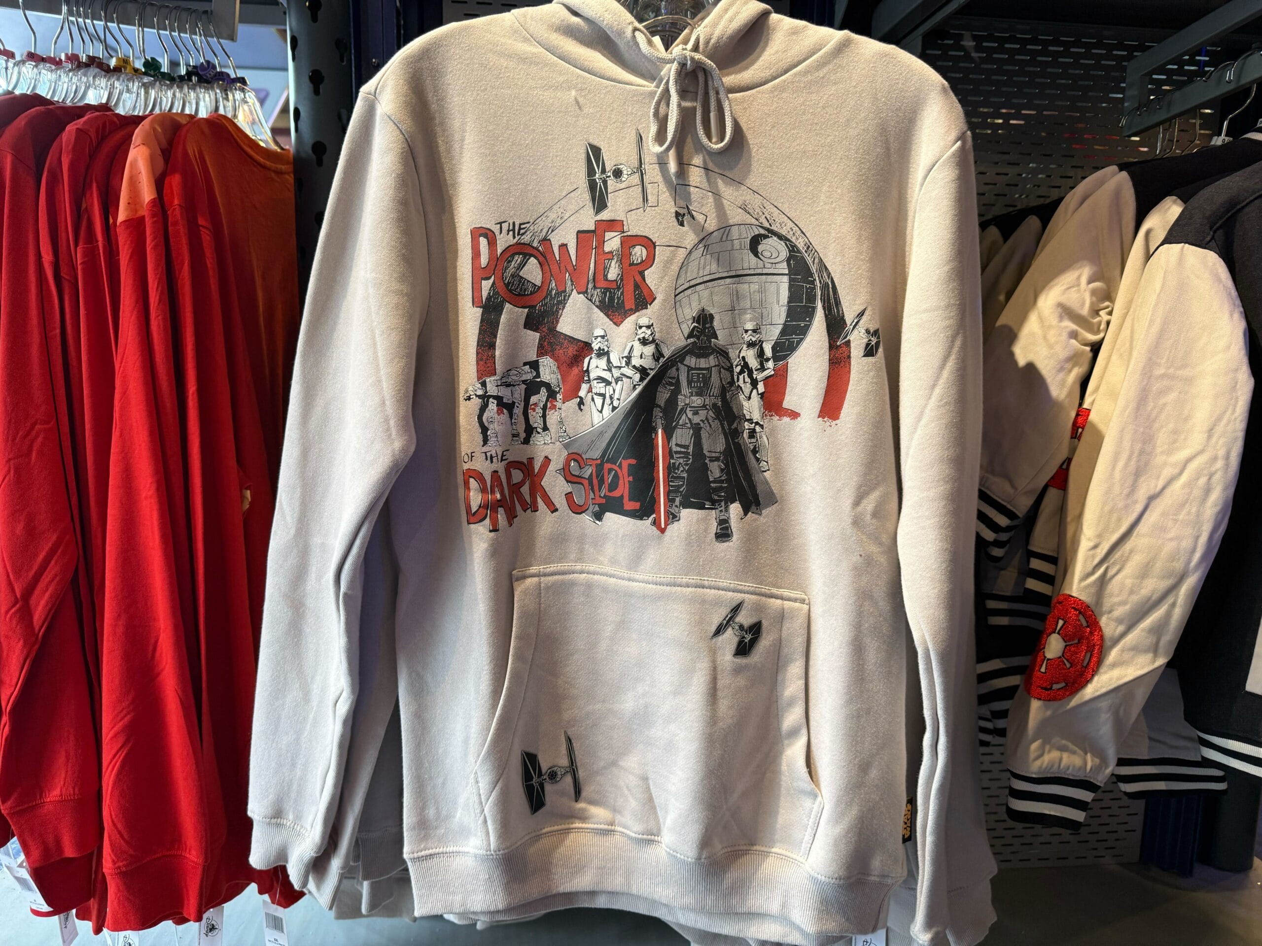 Beige hoodie with Star Wars graphics, Darth Vader and the Death Star, and "The Power of the Dark Side" text, not park-specific.