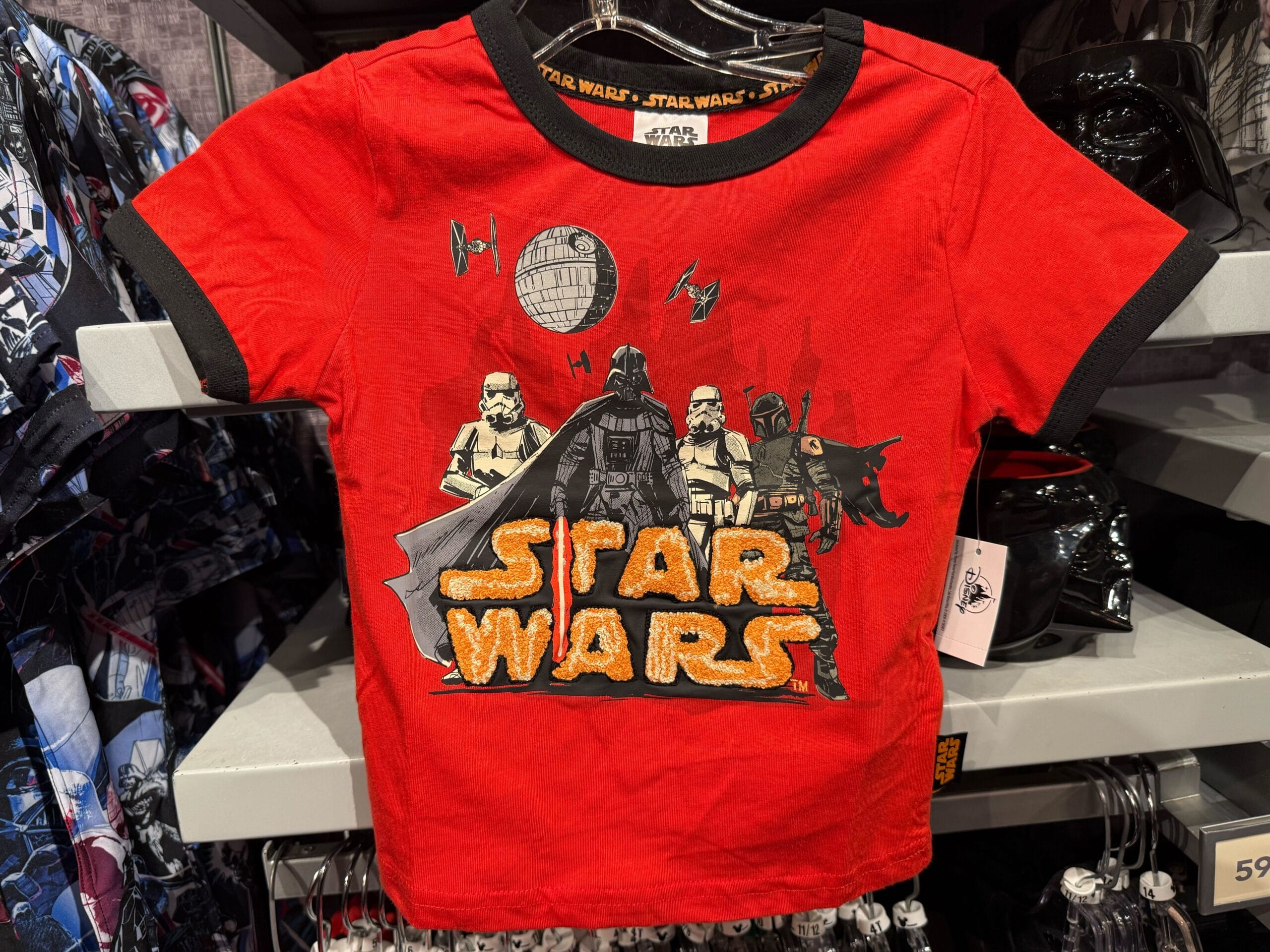 Red Star Wars kids’ tee with Darth Vader, stormtroopers, TIE fighters, and Death Star—Disney Parks exclusive, no castles featured.
