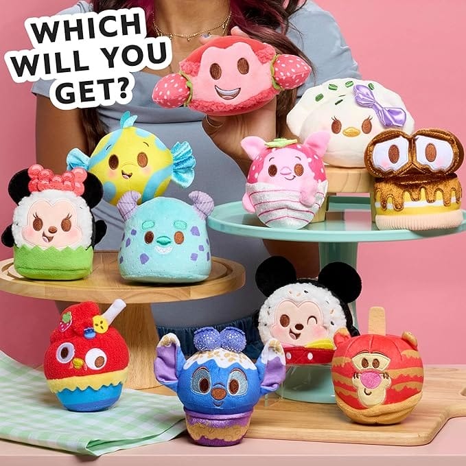 Colorful, plush Disney-themed desserts are displayed on stands for Big Deal Day. Text reads: “Which will you get?”