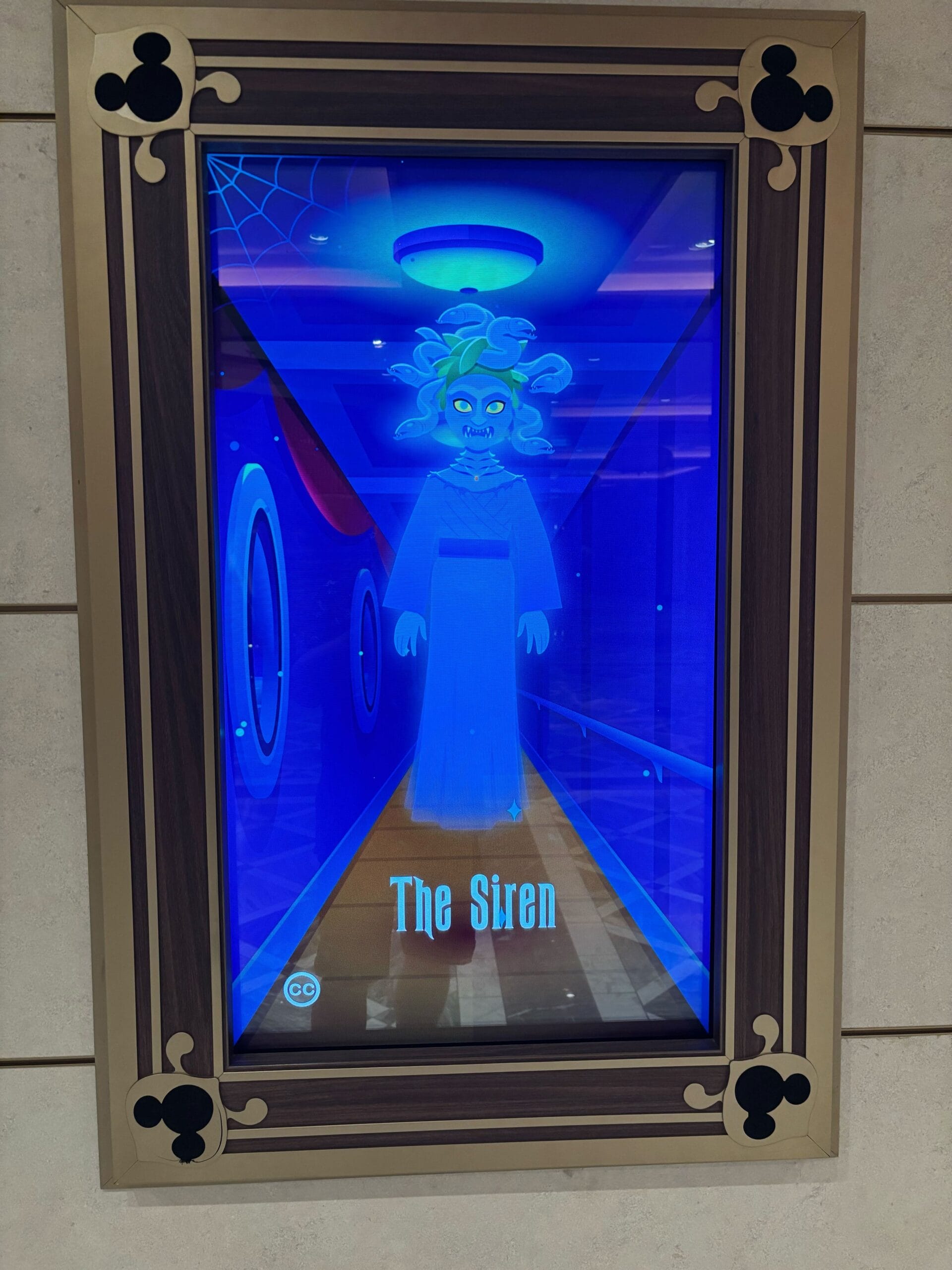A digital display reads "The Siren" in a haunted hallway on Disney Treasure, reminiscent of Disney Park Haunted Mansion decor.