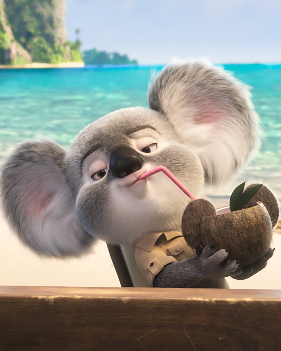 Animated koala with large ears sipping from a coconut on a sunny beach, reminiscent of Disney’s playful park mascots relaxing.