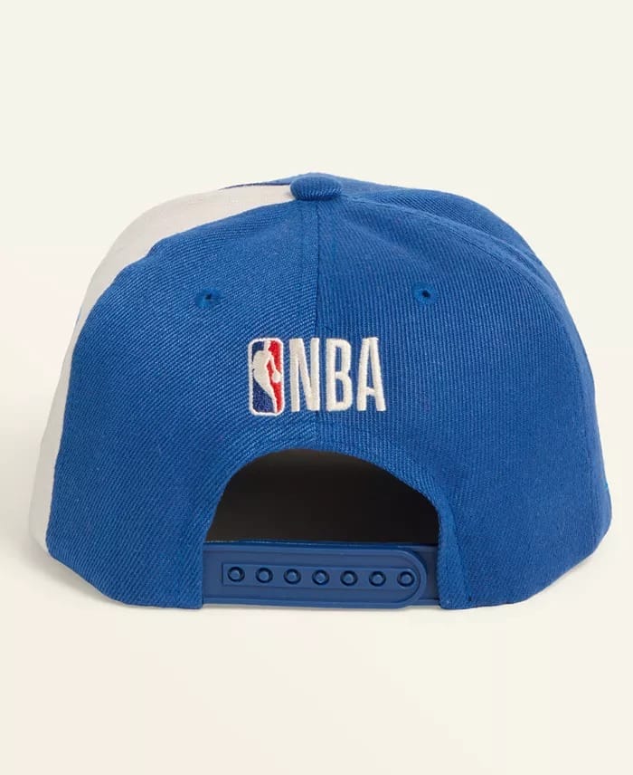 Back view of a blue and white snapback cap from Macy's Collection with the NBA logo, similar to sporty hats seen at Disney parks.