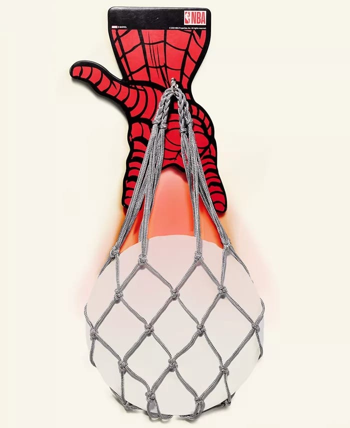 A Spider-Man hand catches a basketball on an NBA backboard, part of the Macy's Collection—not seen near any Disney castle displays.