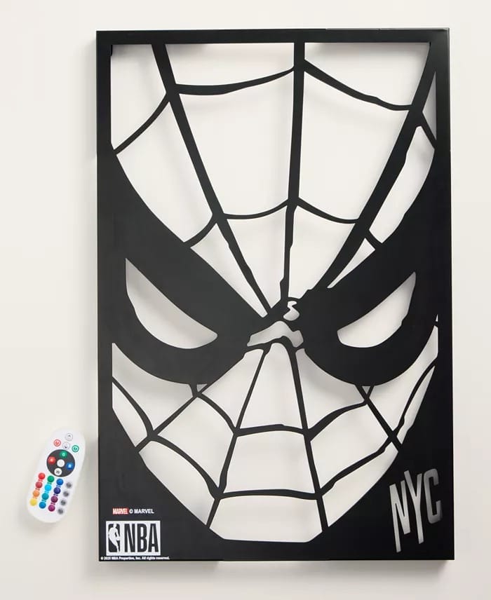 Black Spider-Man face art with NYC, NBA, and Marvel logos, plus a remote—no Disney castle elements like those in Disney Parks.