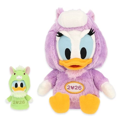 Two plush toys of Donald (green) and Daisy (purple) Duck in animal outfits, 2026 New Year's Tokyo Disney Resort merchandise.
