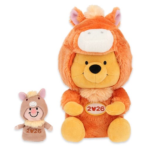 Two plush toys in orange horse costumes marked "2026" as Tokyo Disney Resort New Year’s merch—no castle visible to compare.