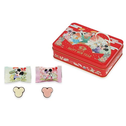 Red tin box featuring Disney characters, Mickey candies, and wrappers—2026 New Year's merchandise at Tokyo Disney Resort; no castle shown.