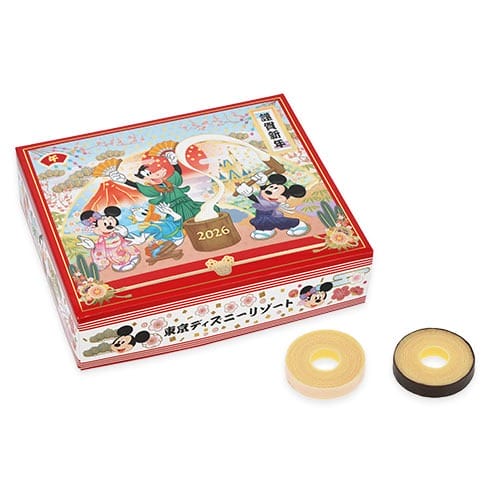 A 2026 New Year's tin from Tokyo Disney Resort, featuring Mickey, Minnie, and two layer cakes; no castle like WDW or Disneyland’s.