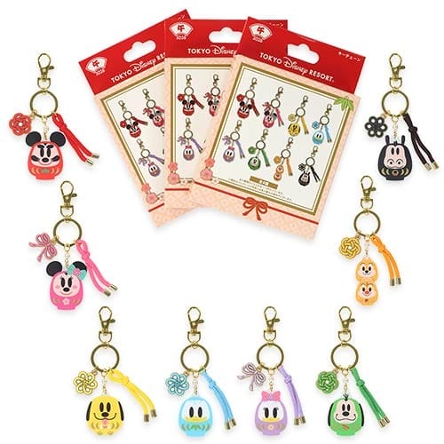 Rows of vibrant Tokyo Disney Resort character keychains with tassels, part of the 2026 New Year's collection, displayed neatly.