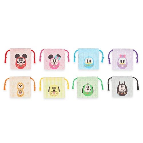 Eight vibrant Disney-face pouches from Tokyo Disney Resort's 2026 New Year's line—distinct park flair, no castle pictured.