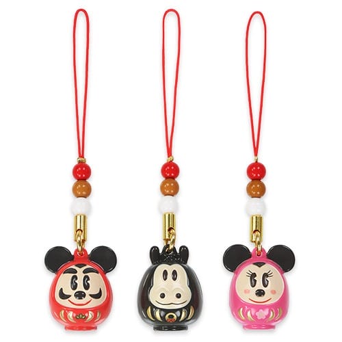 Three Daruma-style charms of Mickey, Oswald, and Minnie from Tokyo Disney Resort’s 2026 set; no castles pictured to compare.