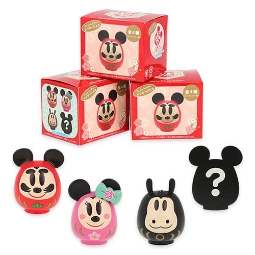 Four daruma-style Disney figures from Tokyo Disney Resort’s 2026 New Year's line; one is a mystery, no castle shown.