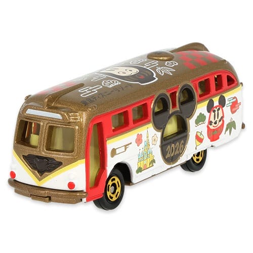 Toy van with Mickey Mouse and 2026, styled like Tokyo Disney Resort’s New Year merch in red, gold, and white. No castle visible.