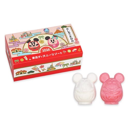 Two mouse-shaped sweets beside a 2026 New Year's gift box at Tokyo Disney Resort, with Japanese theming—not Cinderella Castle.