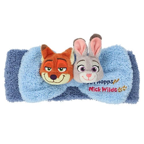 Blue fuzzy headband at Tokyo Disneyland with plush Nick Wilde and Judy Hopps from Zootopia 2—unique to this park’s merch selection.