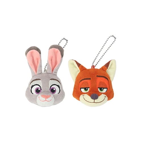 Zootopia 2 Judy Hopps and Nick Wilde plush keychains on white, exclusive Disney Parks merchandise but no castle in view.